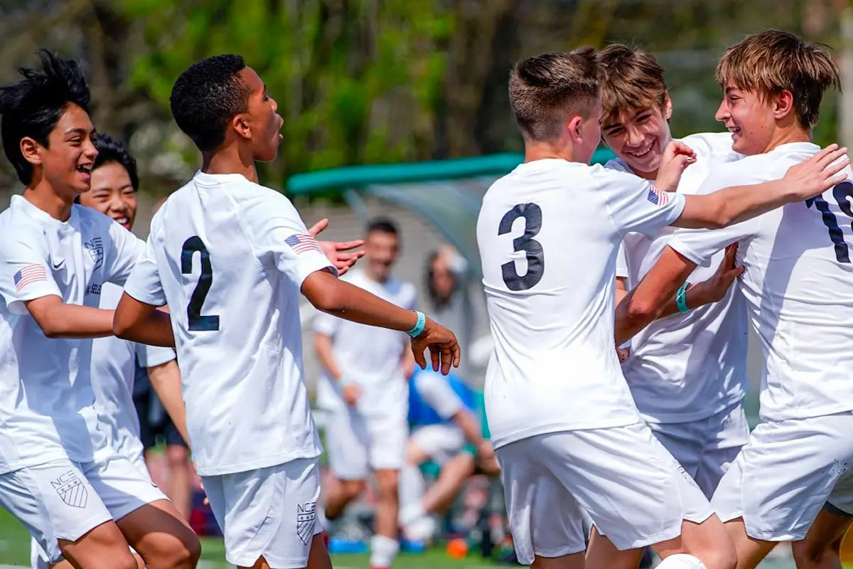 Calciatori giovanili festeggiano un gol durante un match della Yes Cup di Milano, torneo di calcio giovanile internazionale giunto alla sua quarta edizione